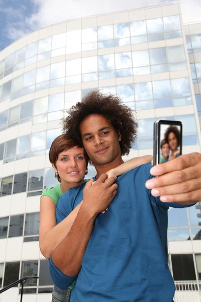 Young couple taking picture of itself — Stock Photo, Image