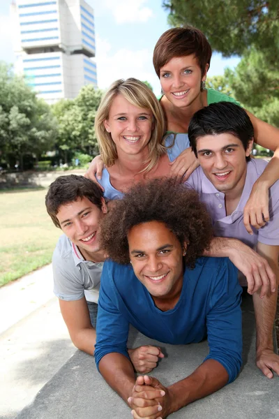 Group of happy students in a park — Stock Photo, Image
