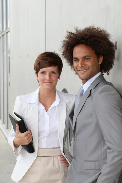 Business standing against a wall — Stock Photo, Image