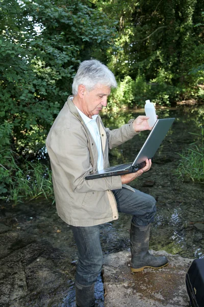 stock image Biologist testing quality of stream water