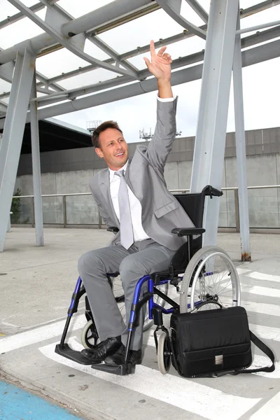 Бизнесмен в инвалидной коляске — стоковое фото