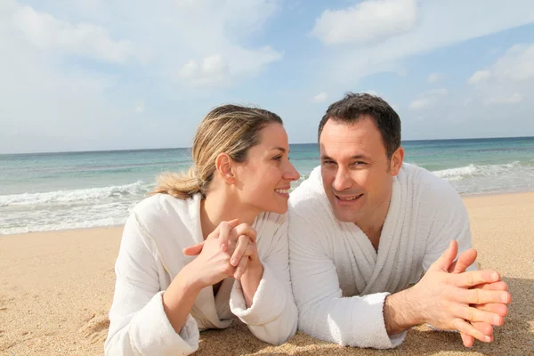 Couple relaxing at the beach Stock Photo
