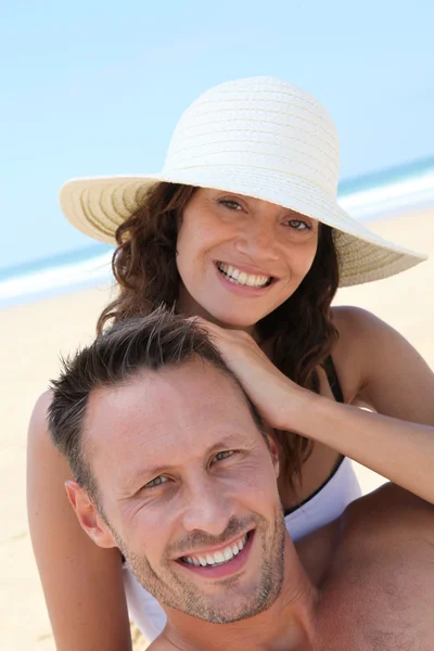 Happy couple at the beach Stock Image