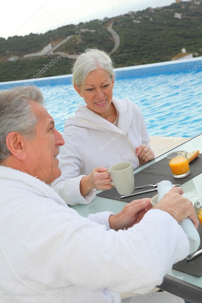 Senior couple having breakfast
