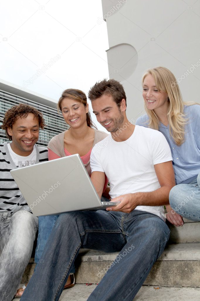 Friends with laptop computer