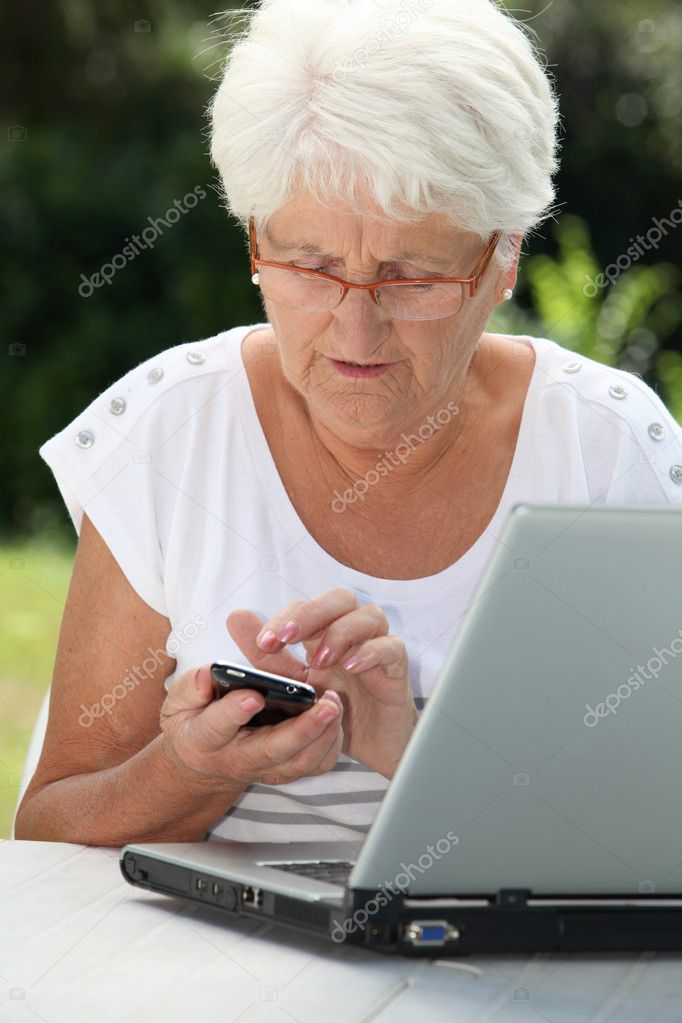 Elderly woman using internet