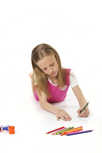 Chica dibuja lápiz sobre papel — Foto de Stock