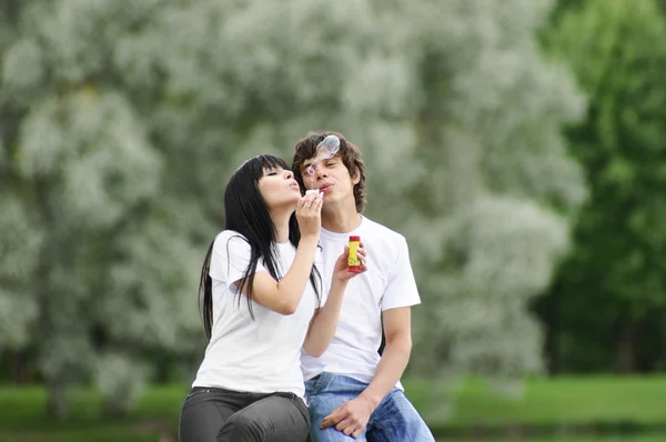Young couple at park — Stock Photo, Image