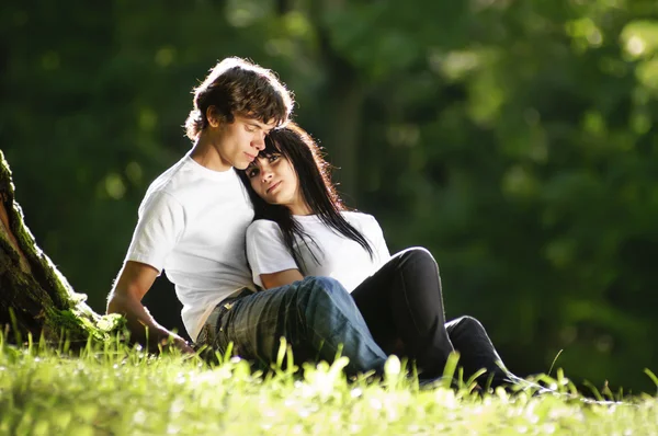 Young couple at park — Stock Photo, Image