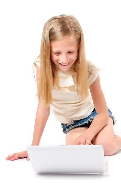 Little girl with laptop on white background Royalty Free Stock Images
