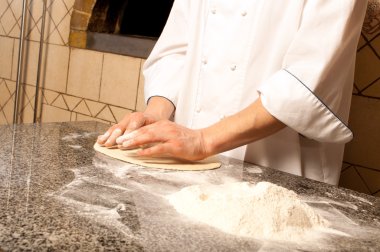 Chef making a Pizza Base clipart