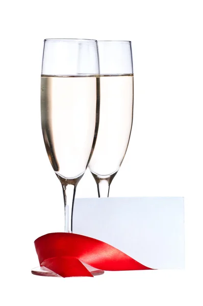 Brýle s šampaňským a prázdné Pozvánka — Stock fotografie