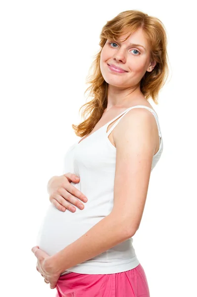 Joven embarazada sosteniendo sus manos sobre su barriga —  Fotos de Stock