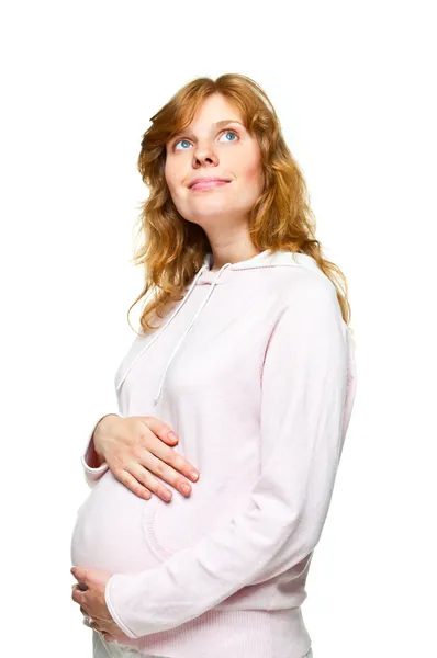 着她的手在她的肚子上的年轻孕妇 — 图库照片