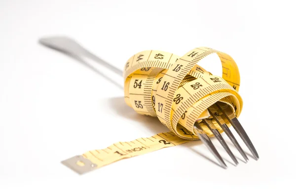 Measuring tape on a fork concept — Stock Photo, Image
