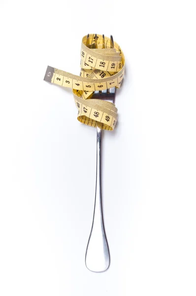 Fita métrica em um conceito de garfo — Fotografia de Stock