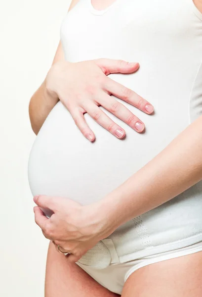 Close-up młodej kobiety w ciąży z gorset — Zdjęcie stockowe