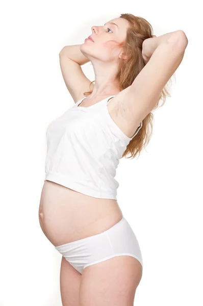 Schöne junge schwangere Frau — Stockfoto