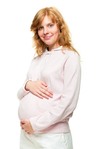 彼女はおなかに彼女の手を繋いでいる若い妊娠中の女性 — ストック写真