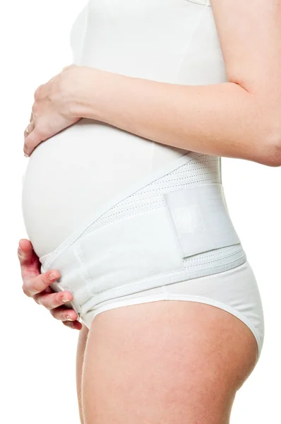 Gros plan d'une jeune femme enceinte avec corset — Photo