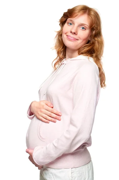 Jovem grávida segurando as mãos na barriga — Fotografia de Stock