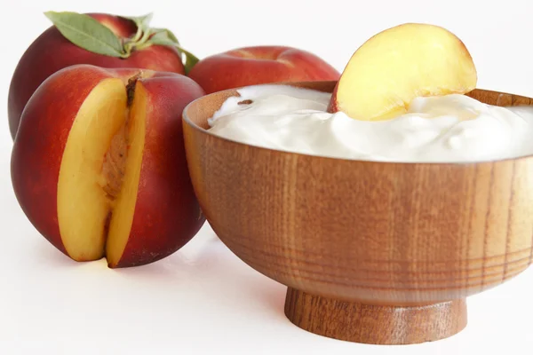 Yogurt with peaches — Stock Photo, Image