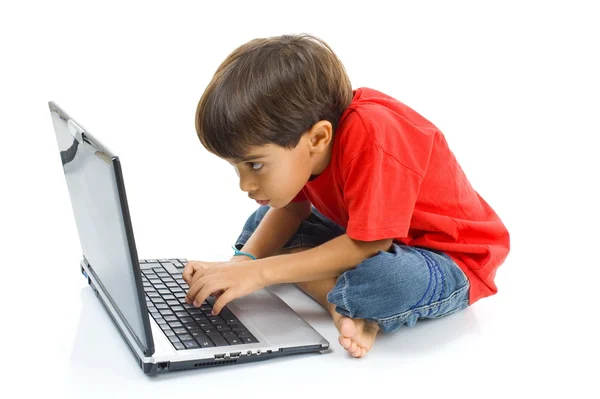 Barn med bärbar dator Stockbild