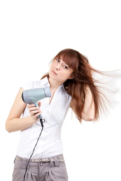 Saç kurutma makinesi olan bir genç kadın — Stok fotoğraf