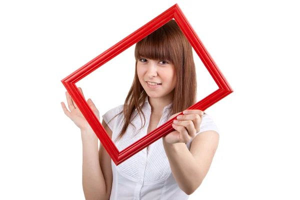 Een jonge vrouw houdt een leeg frame — Stockfoto