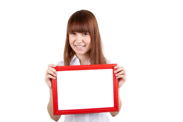 Een jonge vrouw houdt een leeg frame — Stockfoto