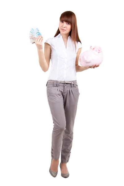 年轻女子与猪存钱罐和钱 — 图库照片