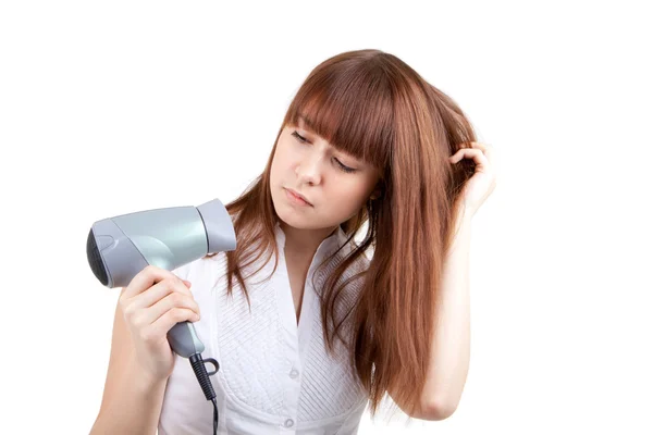 Uma jovem com secador de cabelo — Fotografia de Stock