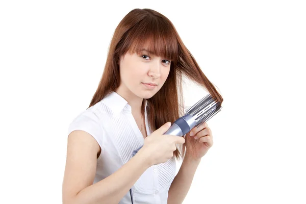 Een jonge vrouw met een haardroger — Stockfoto