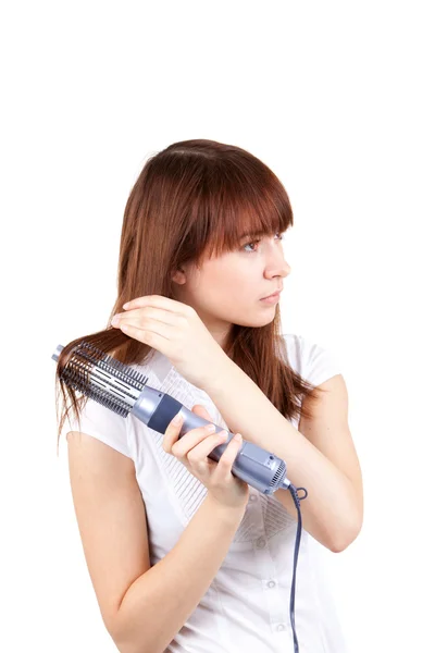 A young woman with a hairdryer — Stock Photo, Image