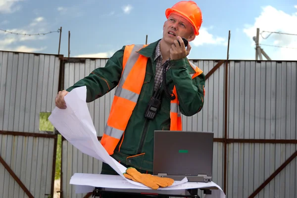 Engineer in orange helmet and jacket. — Stock Photo, Image