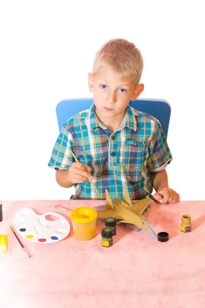 Boy paint airplane model — Stock Photo, Image