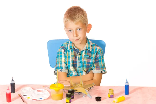 Boy paint airplane model — Stock Photo, Image