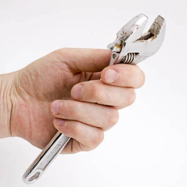 stock image Adjustable wrench in hand