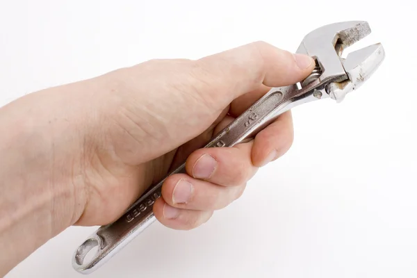 Stock image Adjustable wrench in hand