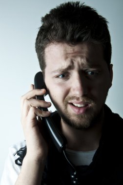 Young man on the phone clipart