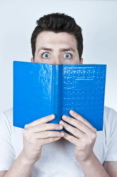 stock image Afraid man reading a book