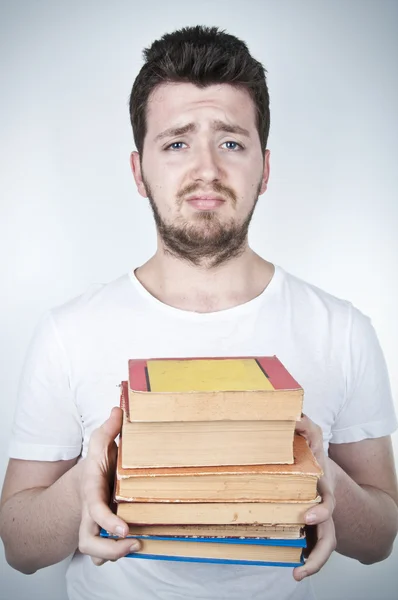 stock image Sad student holding books