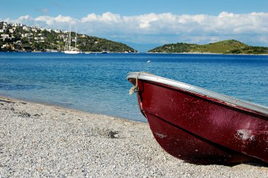 Fishing boat on the beach clipart