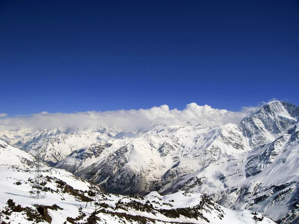 stock image Mountain under the blue sky and the clouds