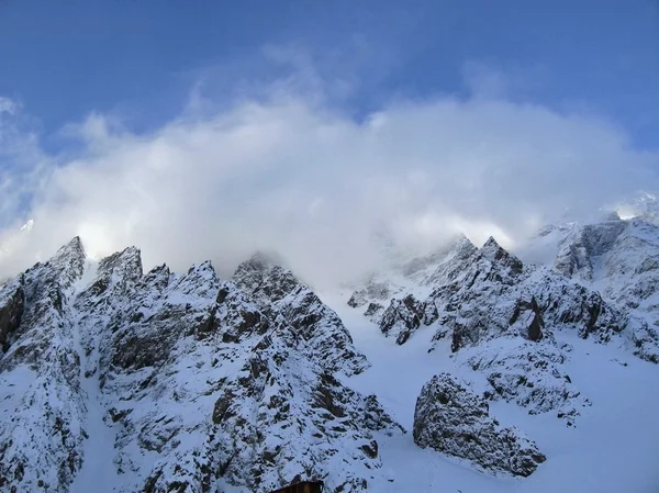 stock image Mountain under the blue sky and the clouds