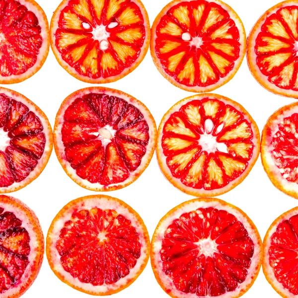 Wiersze plasterki czerwonych pomarańczy — Zdjęcie stockowe