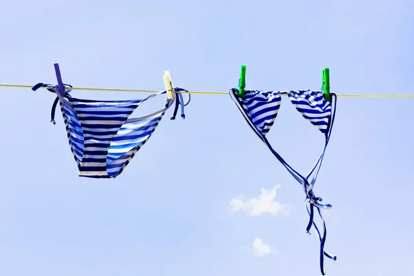 Drying woman swimsuit Stock Photo