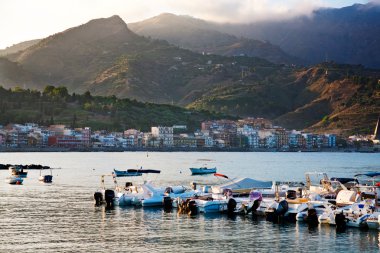 Sunset in port of Giardini Naxos clipart