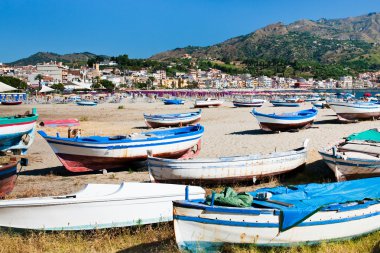 Old boats on beach, Sicily clipart