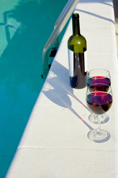 Bottle and two glasses with red wine outdoor — Stock Photo, Image